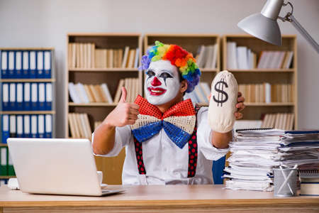 Clown businessman working in the officeの写真素材
