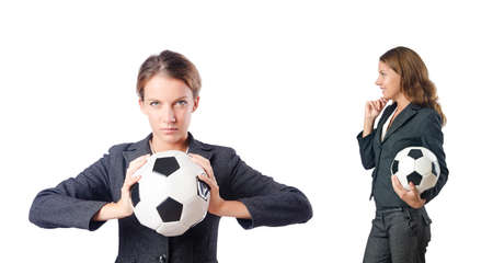 Businesswoman with football on whiteの写真素材