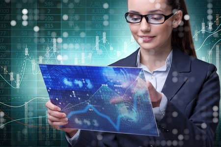 Businesswoman in stock exchange trading concept