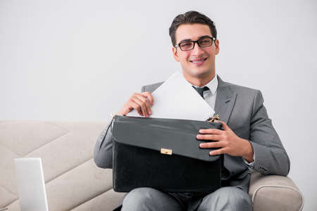 Businessman with briefcase in business conceptの写真素材