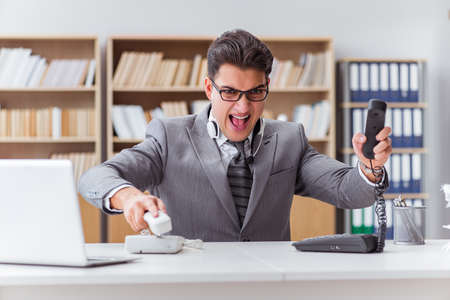 Angry helpdesk operator in the officeの写真素材