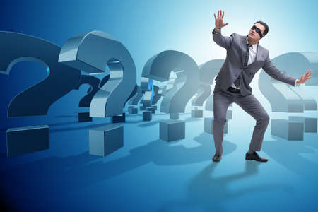 Blindfold businessman in incertainty conceptの写真素材