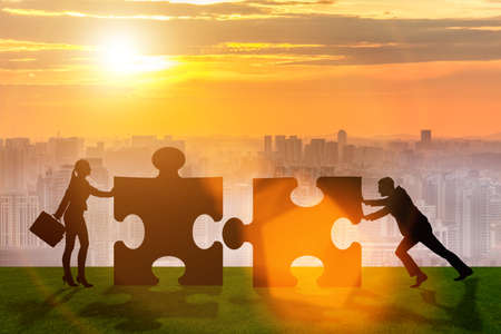 Business metaphor of teamwork with jigsaw puzzleの写真素材
