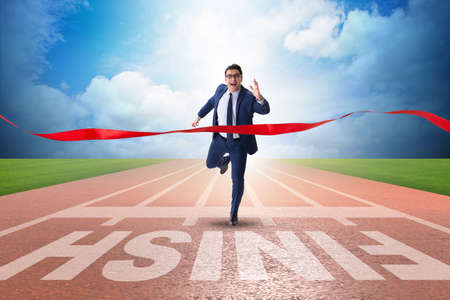 Businessman on the finishing line in competition conceptの写真素材