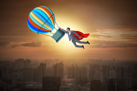 Businessman flying on balloon in challenge conceptの写真素材
