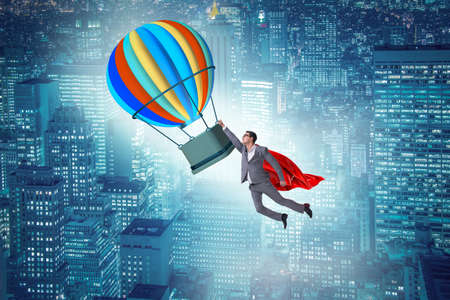 Businessman flying on balloon in challenge conceptの写真素材