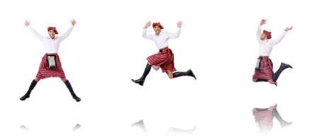 Scottish man dancing on whiteの写真素材
