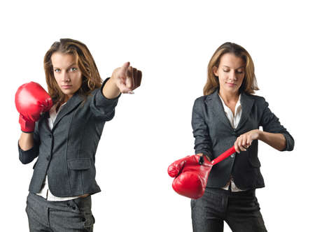 Young woman with boxing gloves isolated on whiteの写真素材