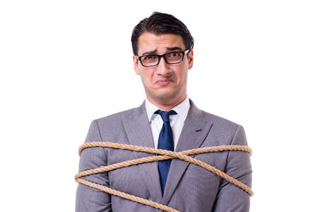 Businessman tied up with rope isolated on whiteの写真素材