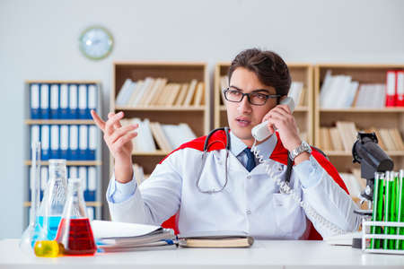 Superhero doctor working in the hospital labの写真素材