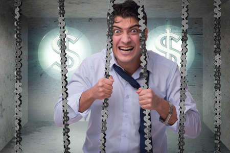 Man trapped in prison with dollarsの写真素材