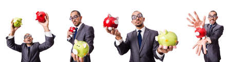 Businessman with piggybank on whiteの写真素材