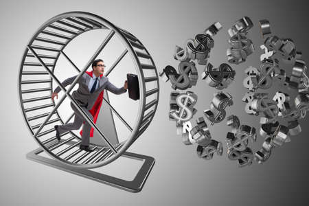 Business concept with businessman running on hamster wheelの写真素材