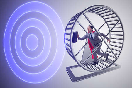 Businessman running on hamster wheelの写真素材