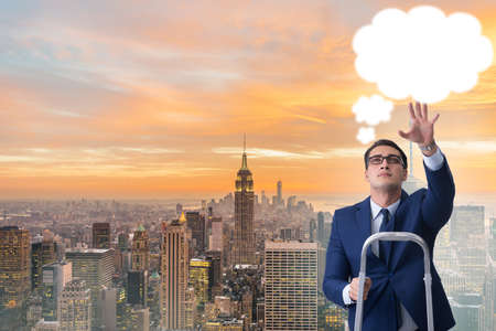 Businessman reaching out to callout messageの写真素材