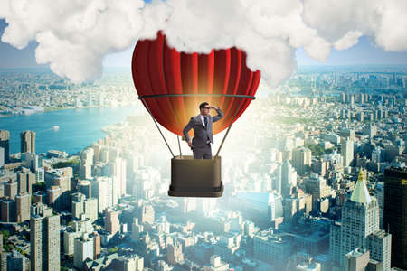 Businessman flying on balloon in challenge conceptの写真素材