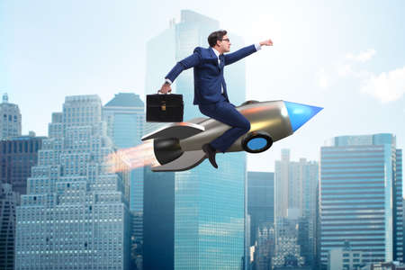 Businessman flying on rocket in business concept