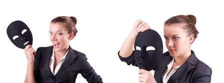 Woman with mask in hypocrisy conceptの写真素材