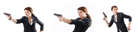 Woman businewoman with hand gunの写真素材