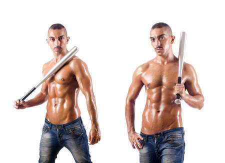 Muscular man with baseball bat on whiteの写真素材
