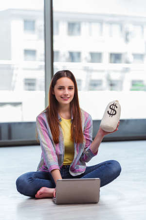 Young girl in online business conceptの写真素材