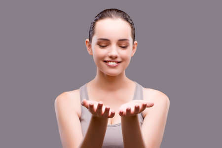 Young sports girl pressing virtual buttonの写真素材