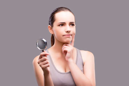 Young girl with magnifying glassの写真素材