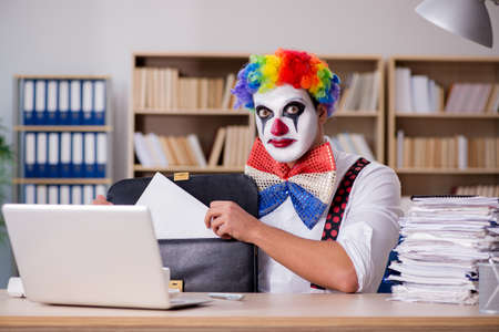 Clown businessman working in the officeの写真素材