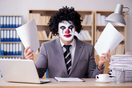 Clown businessman working in the officeの写真素材