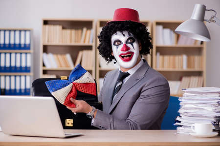 Clown businessman working in the officeの写真素材