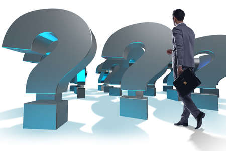 Businessman with question marks isolated on whiteの写真素材