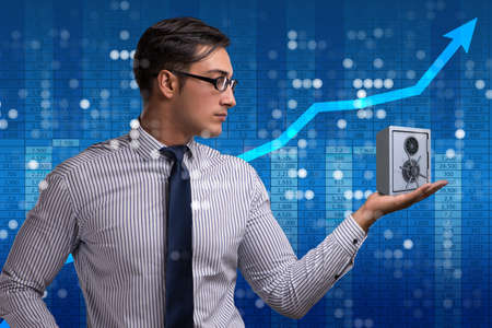Businessman in security concept with safeの写真素材