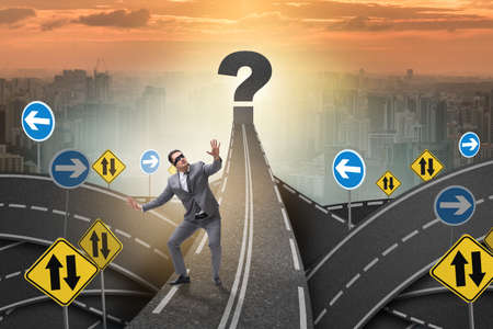 Blindfold businessman on the road unsureの写真素材