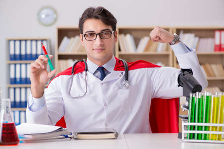 Superhero doctor working in the lab hospitalの写真素材