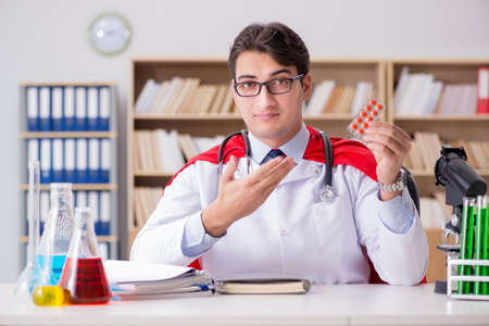 Superhero doctor working in the lab hospitalの写真素材