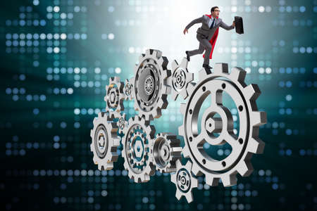 Businessman in teamwork concept with cogwheelsの写真素材