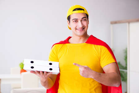 Superhero pizza delivery guy with red coverの写真素材