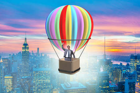 Businessman flying on balloon in challenge conceptの写真素材