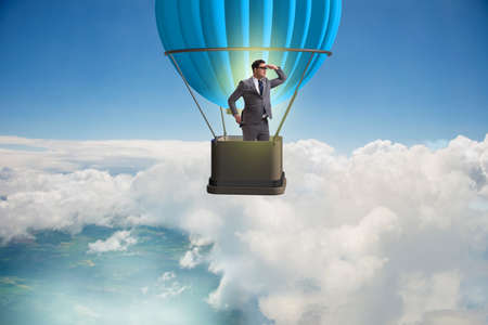 Businessman flying on balloon in challenge conceptの写真素材