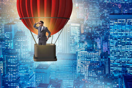 Businessman flying on balloon in challenge conceptの写真素材
