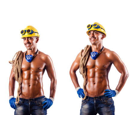 Muscular builder with tools isolated on whiteの写真素材