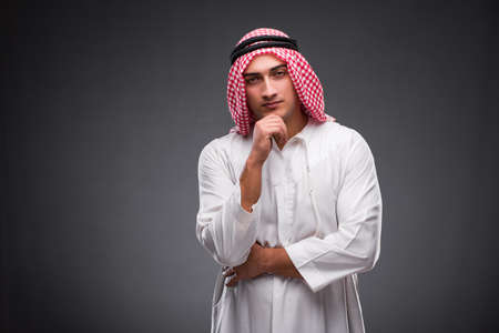 Arab businessman on gray backgroundの写真素材