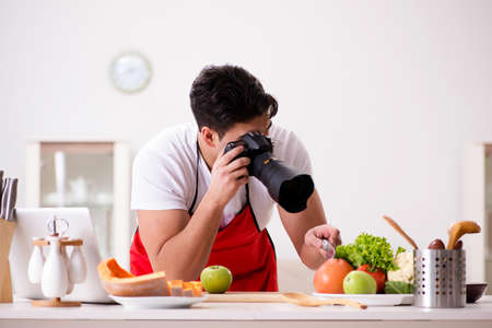 Food blogger working in the kitchenの写真素材