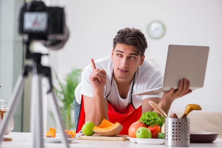 Food blogger working in the kitchenの写真素材