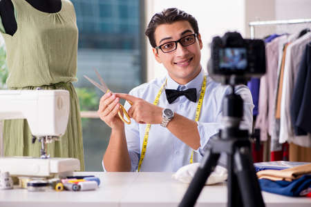Young man working as fashion video bloggerの写真素材