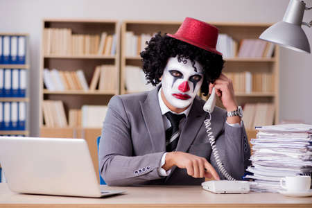Clown businessman working in the officeの写真素材