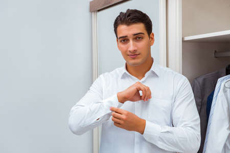 Businessman dressing up for workの写真素材