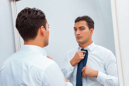 Businessman dressing up for workの写真素材