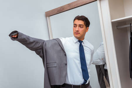 Businessman dressing up for workの写真素材
