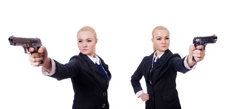 Woman with gun isolated on whiteの写真素材